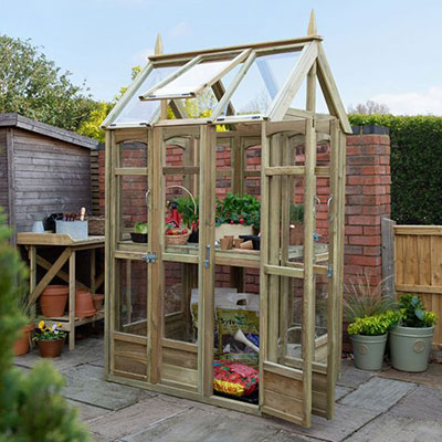 a small wooden greenhouse with automatic vent